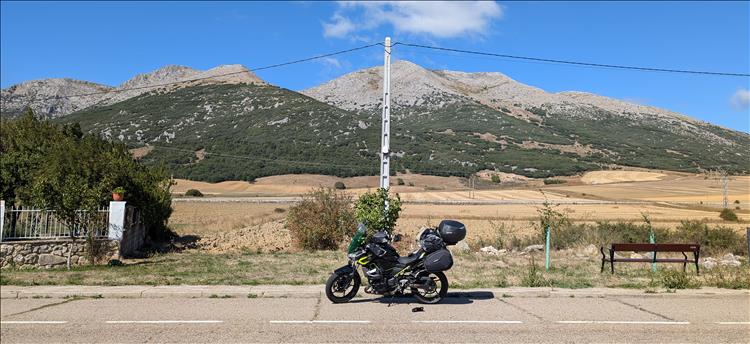 The Z400 in touring trim against rocky mountains and sunshine in Spain