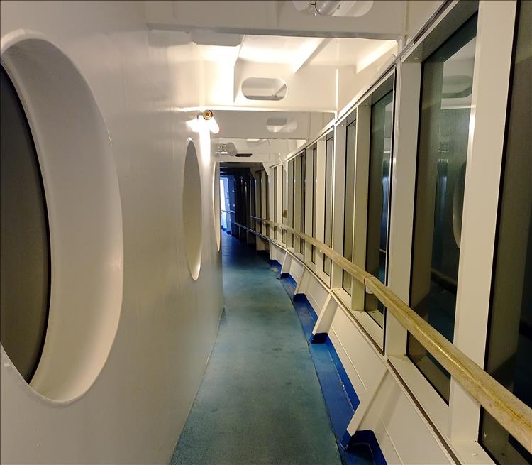 A covered walkway around the bow of the Pont Aven