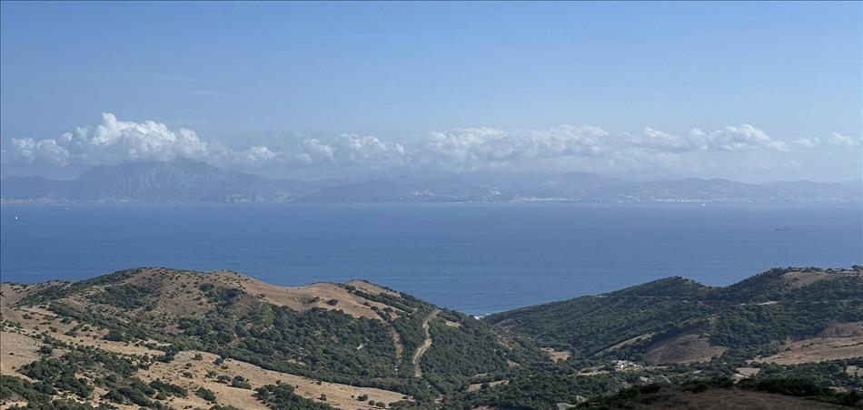 A few hills and valleys, then the sea, and more hills across the water