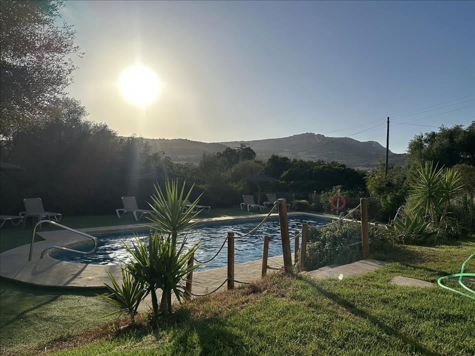 The small pool, the bright but now low sun, and of course mountains