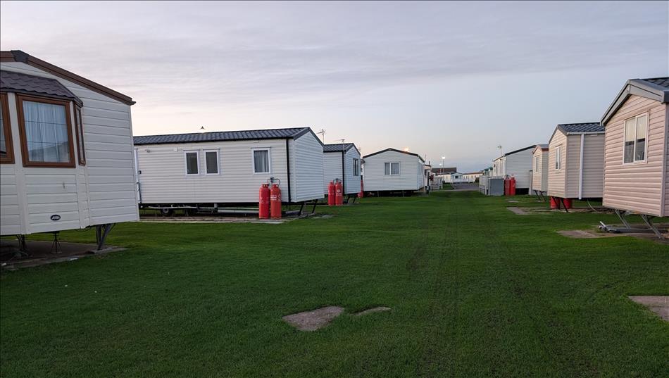 Static caravans in rows with just grass between them