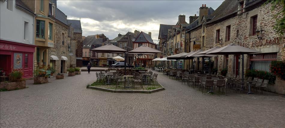 The rather pretty square is filled with tables and surrounded by old french buildings