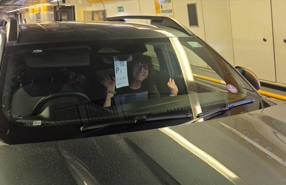 Meg waves at us from her car in the Channel Tunnel