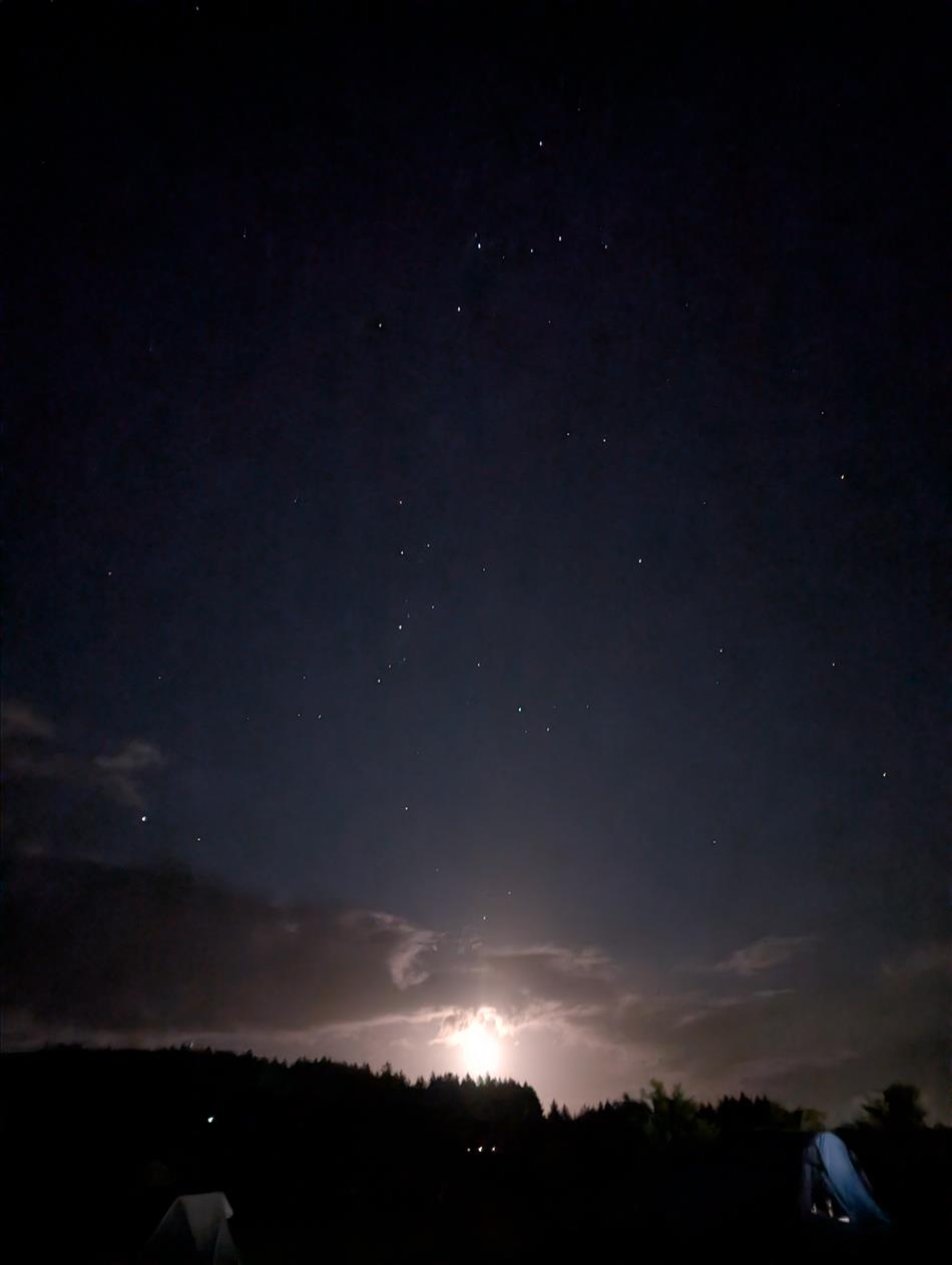 Stars and monlight between clouds