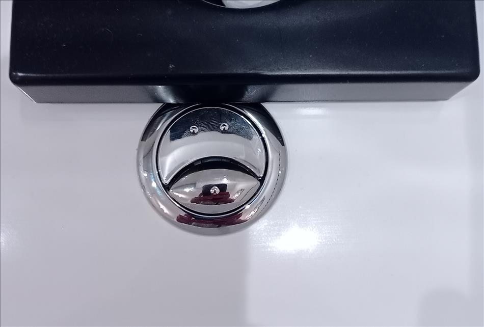 Push button toilet flush but it looks like a really sad face emoji in chrome