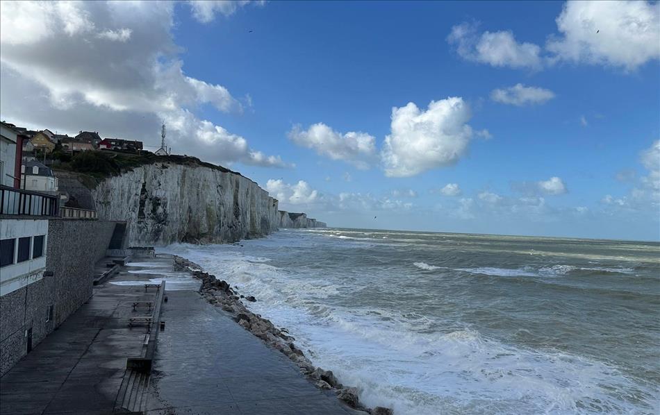 White cliffs, large waves and the concrete sea defences at Ault