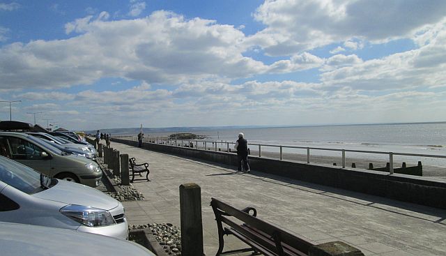 the promenade and the benches alongside tywyn beach