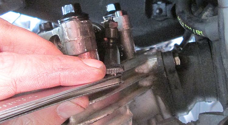 Using feeler gauges in the cylinder head
