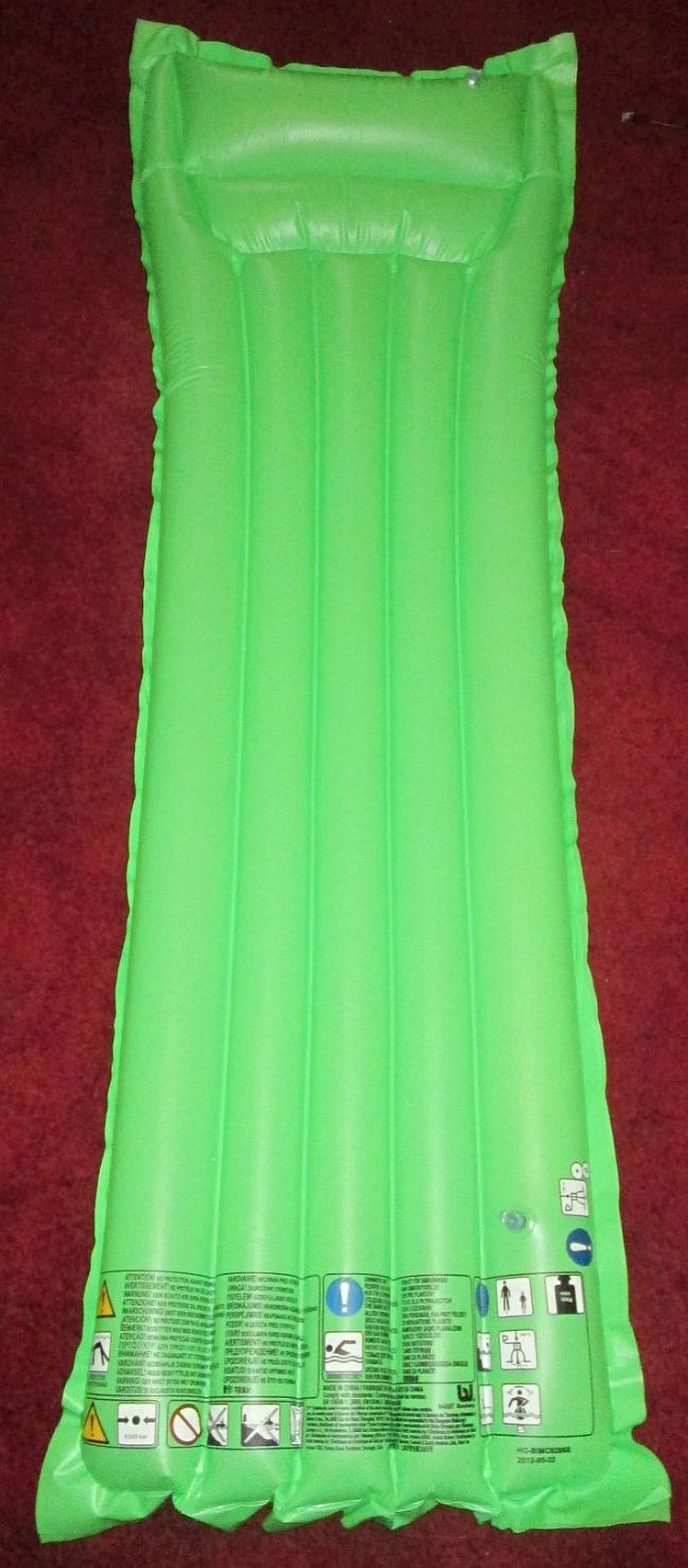an ordinary, simple green plastic lilo