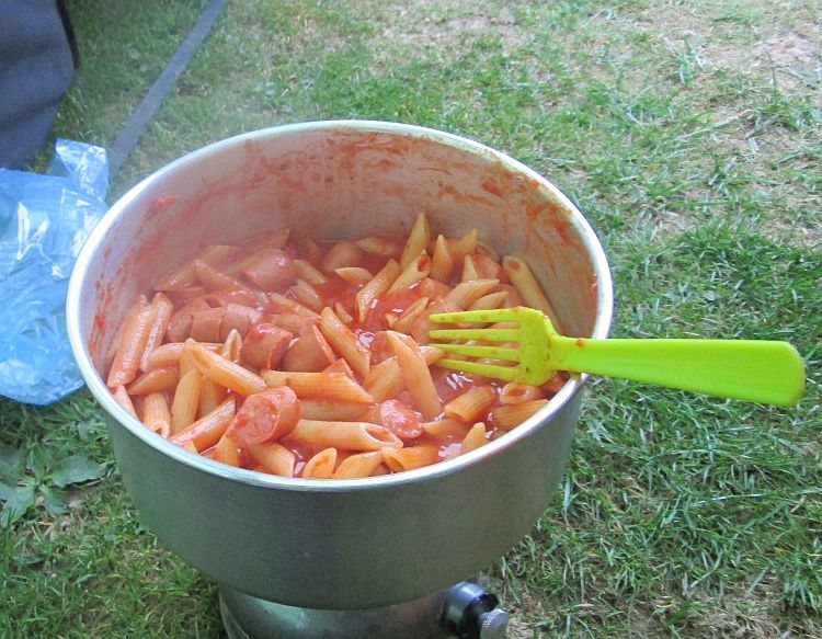 the final product, pasta, hot dogs and the tasty sauce in a pan