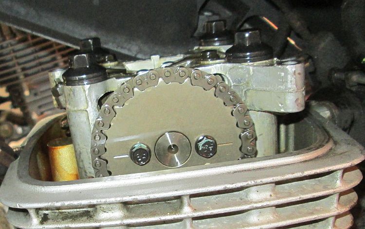 the timing marks on the camshaft, lined up with the cylinder head