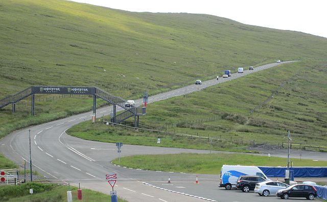 a line of traffic on the mountain road of the Isle of Man