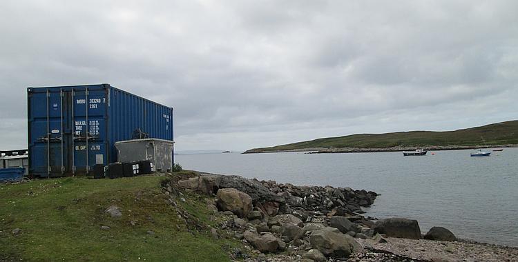 A blue shipping container near the shore line at Polbain