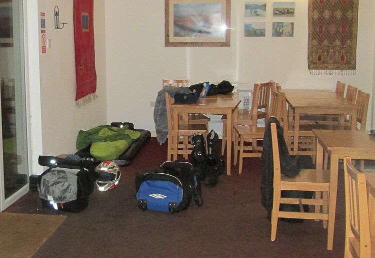 the airbed and gear in the corner of the room at takoda camping