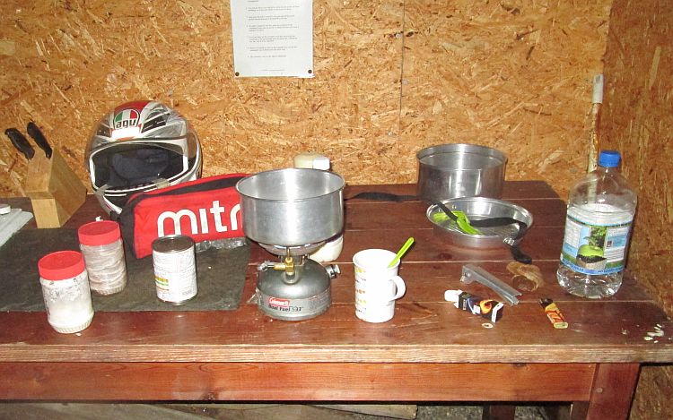 camping cooking with stove, pans and pots in the shelter at lagnaha