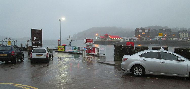 Oban harbour in the fading light, mist, rain and cold of winter