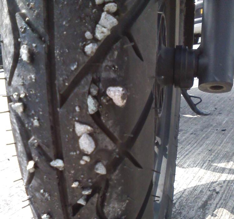 the stones still stuck to Sharon's tyre even after the spill