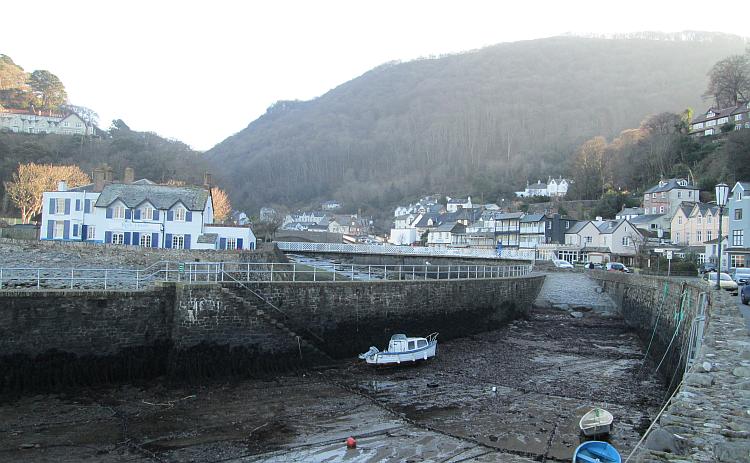 A village set in a steep valley and a river flowing into a harbour at Lynmouth