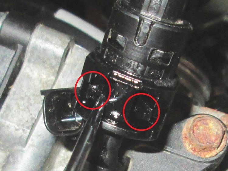 The 2 tangs or clips that keep the connector on the fuel pipe