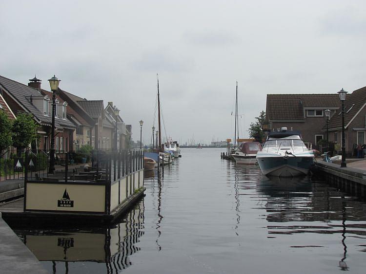 The tranquil canal with boats and houses at Oude Wetering