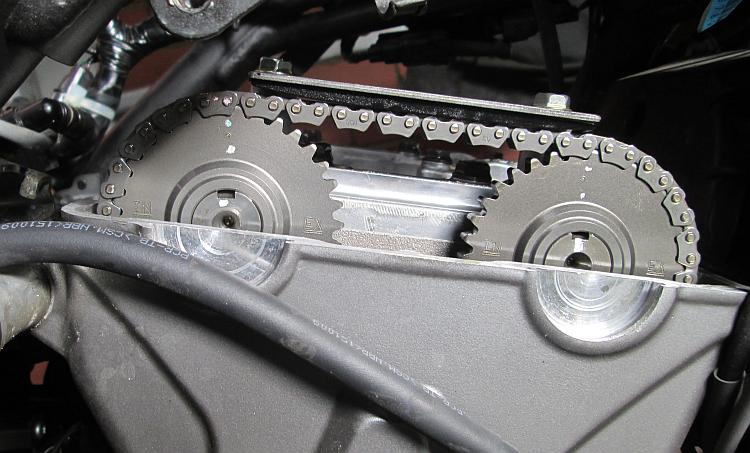 The camshaft's timing marks are alighed to the top of the cylinder head