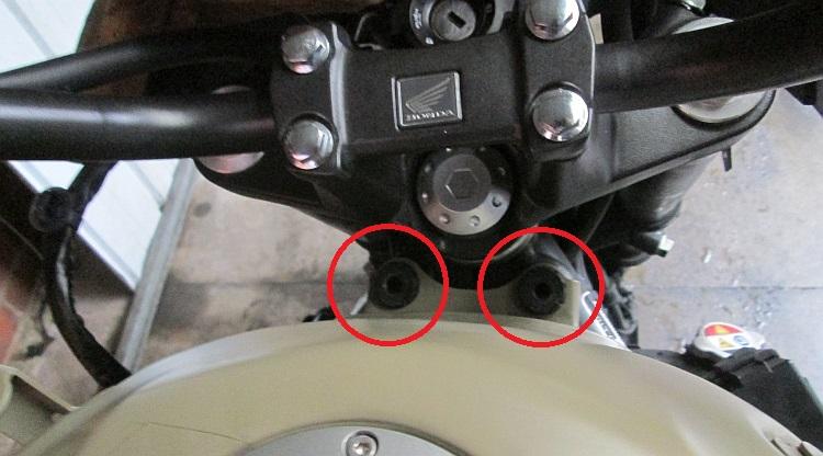 2 tank mount bolt holes circled in red