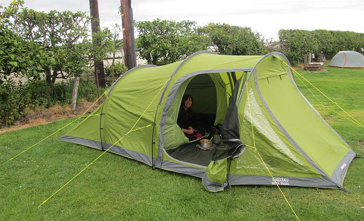 Sharon looks out from the tent with a smile on her face at the Ayrshire campsite